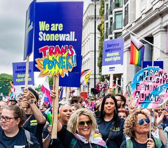Stonewall staff and supporters with banners at Pride London, July 2025