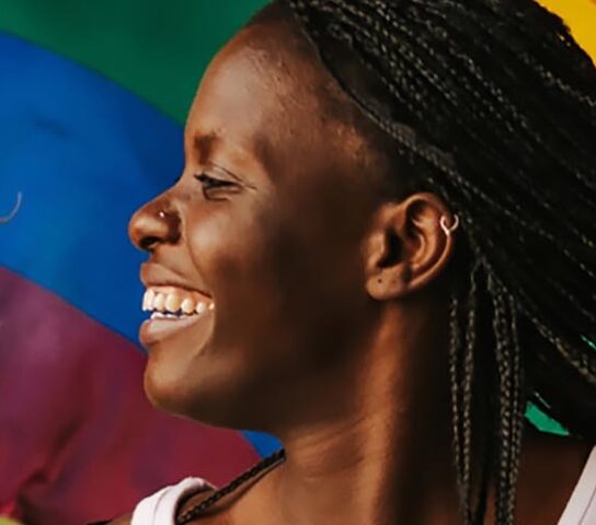 A couple with a pride flag