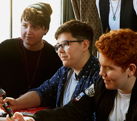 Young people sat around a table