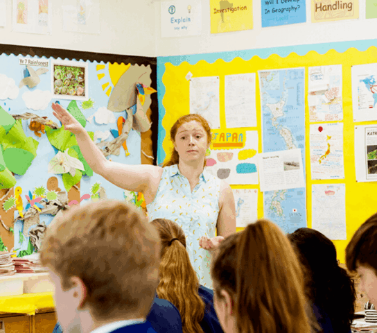 Teacher in front of a classroom.