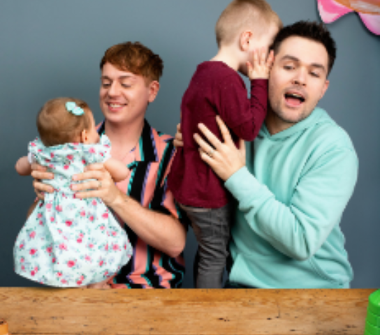 Two dads and their two children.