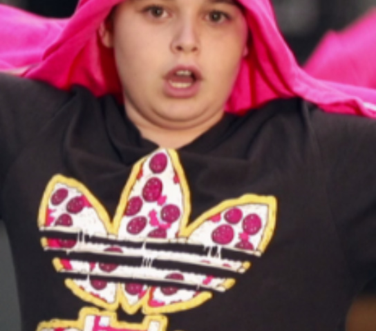Photo of a boy in a pink hoody.