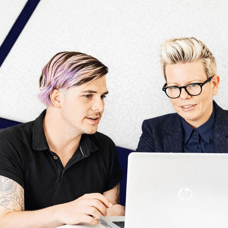 Two people in office laptop 800x800