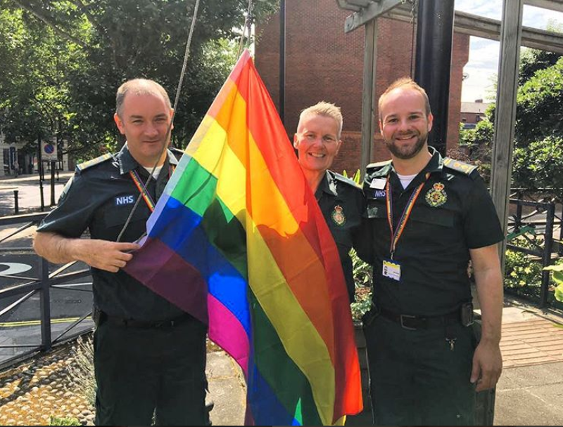 Staff with rainbow flag © London Ambulance Service