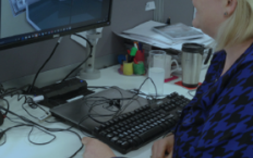 A civil engineer working at her computer