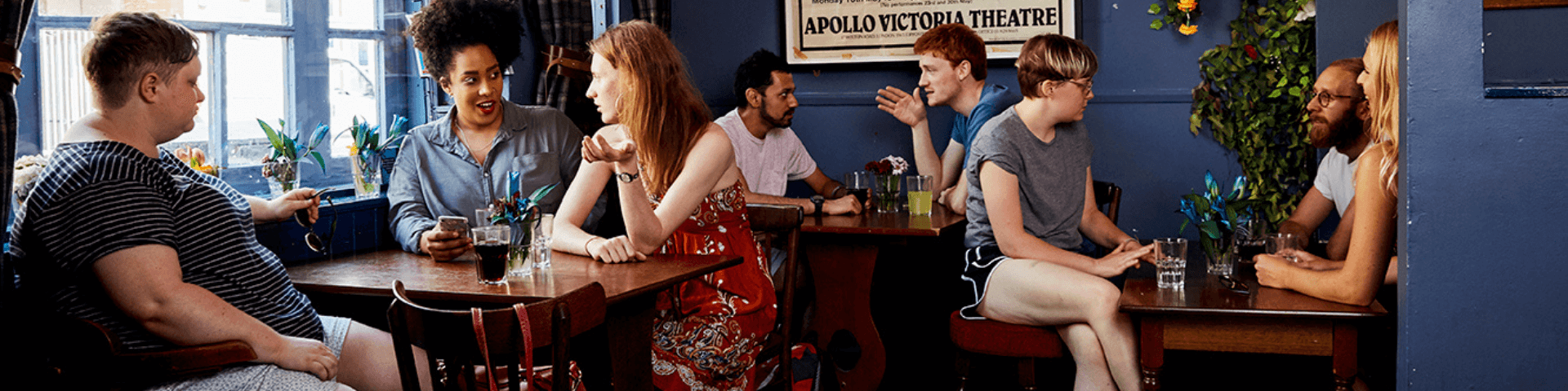 Group of people sitting together in a pub